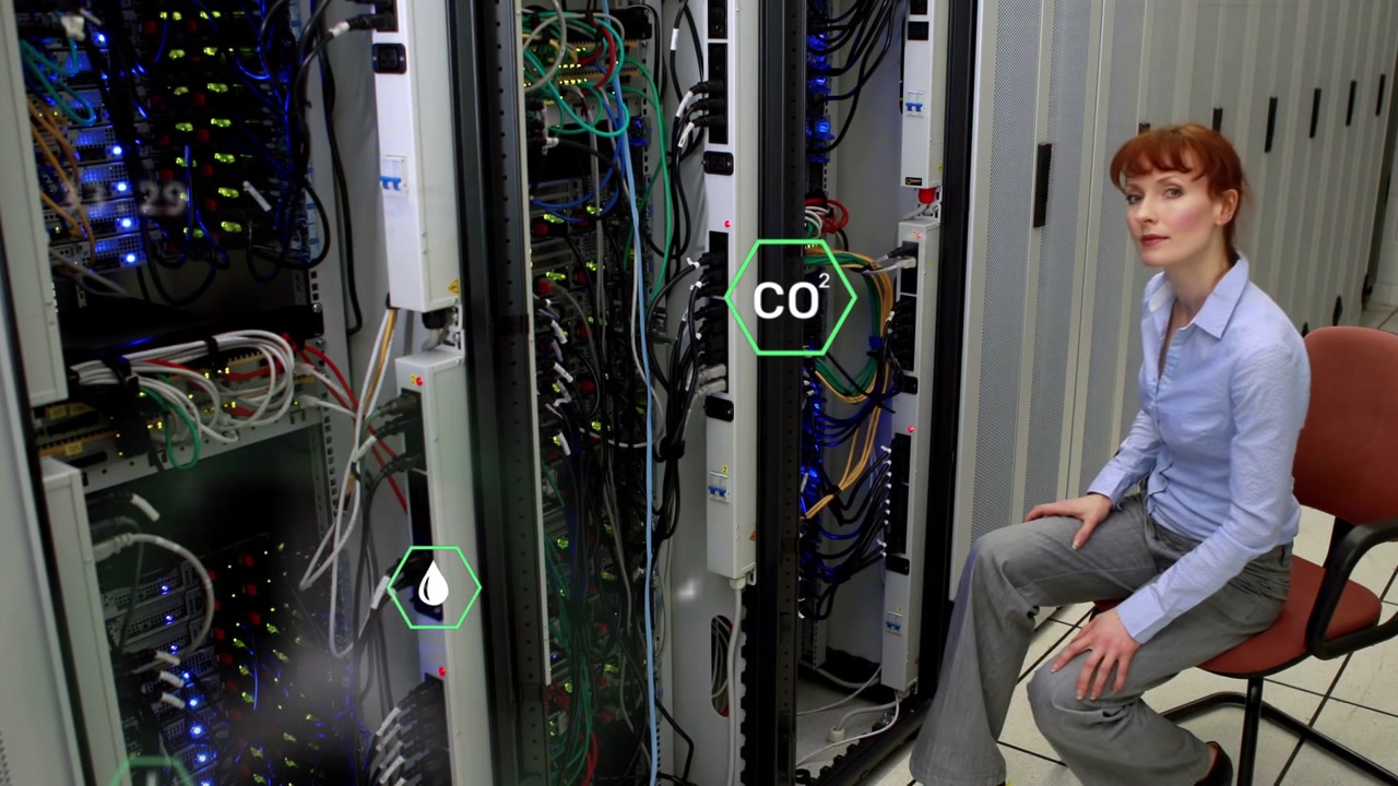 On alert, engineer leaning into racks, checking system health with updating holograms near gaze