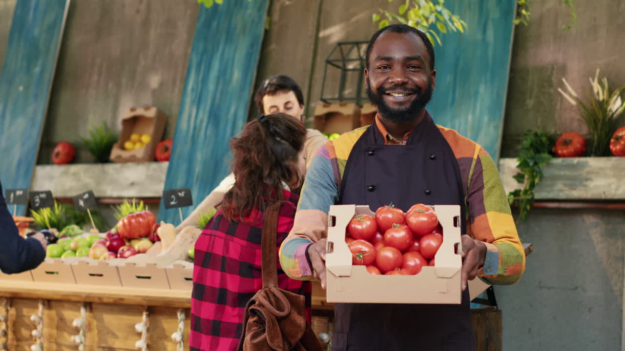 Farmer holding tomatoes at market