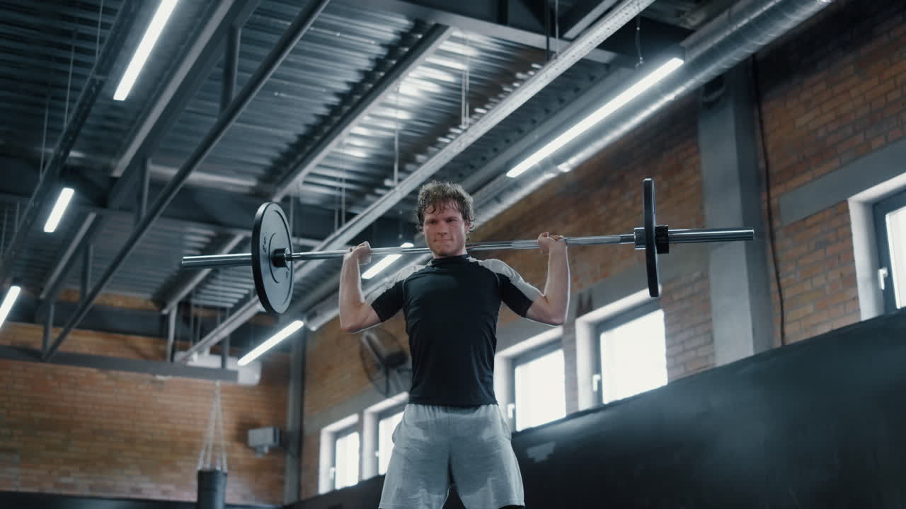 Kickboxer lifting dumbbells