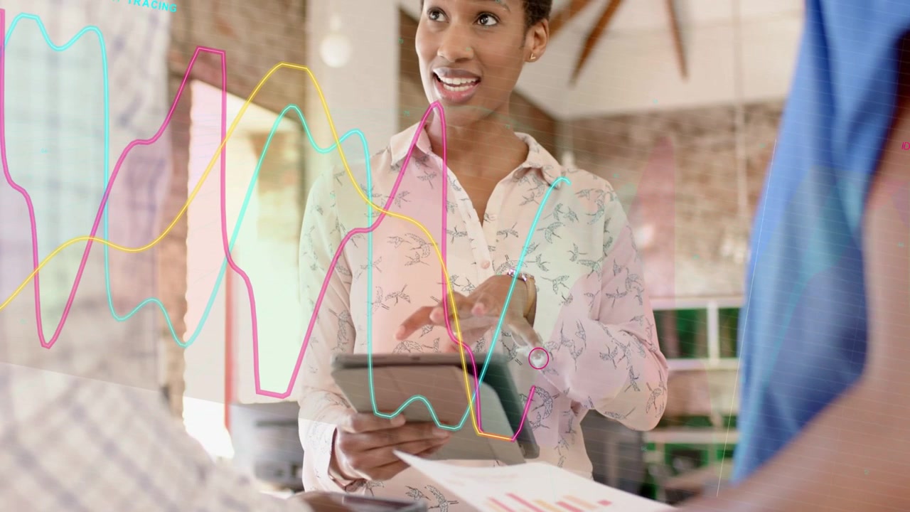 Female lead tapping tablet, guiding team in data review, animated graphs emerging overlaying charts