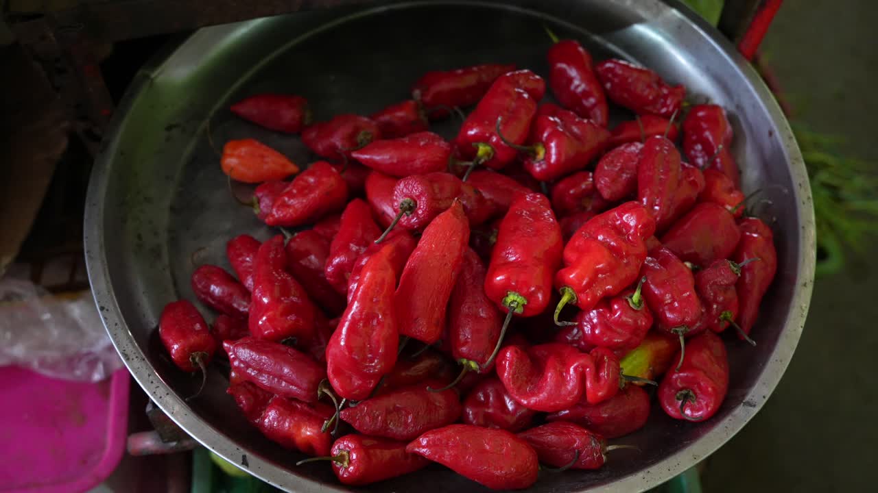 Big Red Chili Peppers At Market in South America. Close Up