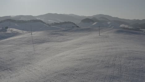 a snow view of a hill with contour-like lines