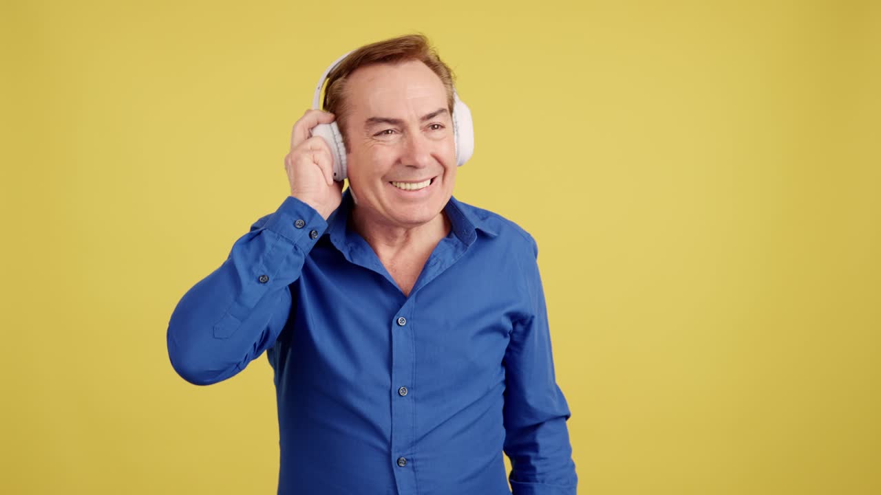 Man with headphones dancing and singing with various expressions on a yellow background