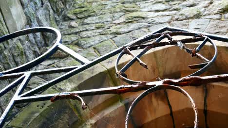 Caernarfon-town-rusted-wrought-iron-star-of-David-gate-entrance-to-Masonic-stone-archway-building