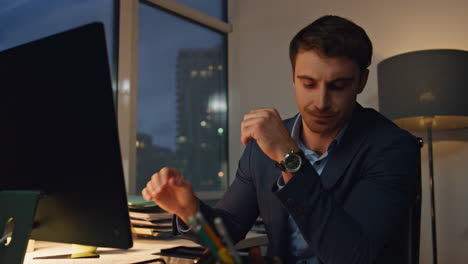 company executive working late in office closeup. tired manager checking report