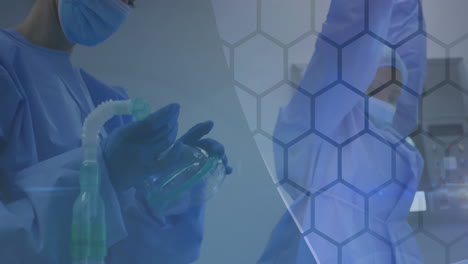 in hospital, medical professionals in protective gear treating patient with animation overlay