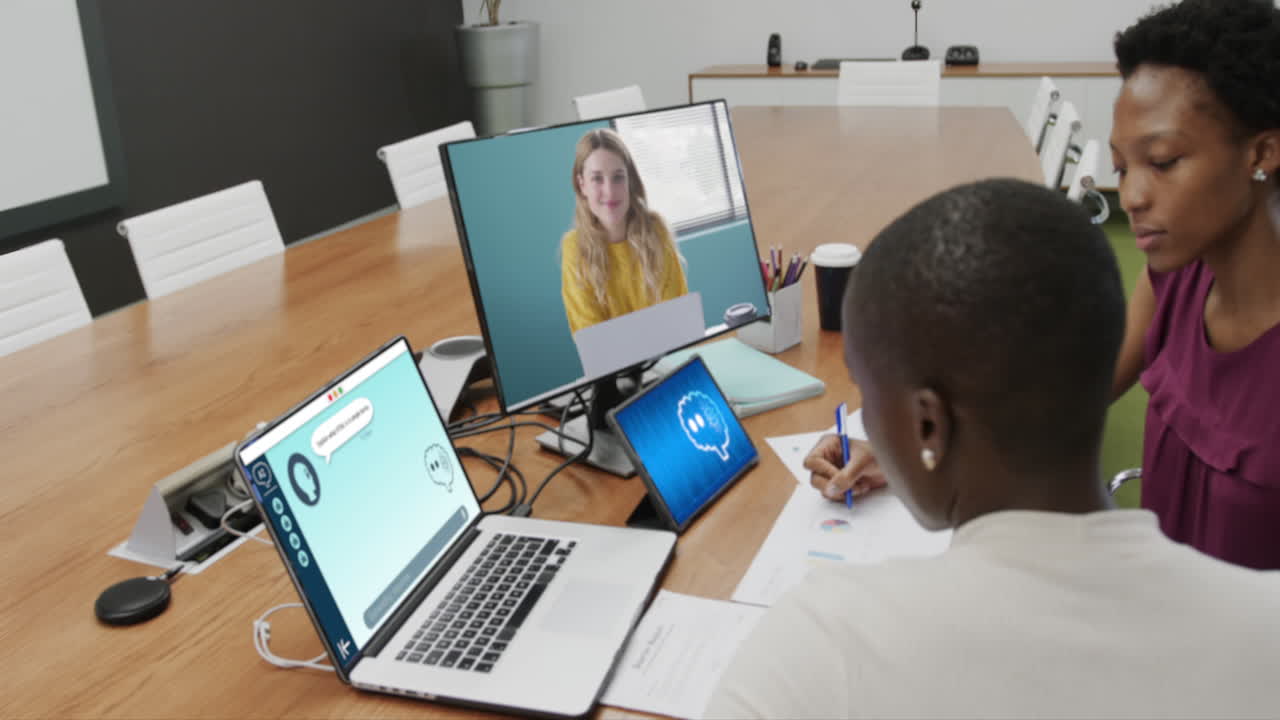 African american businesswomen using computers with data processing in office