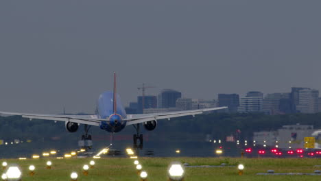 airplane landing at an airport at twilight