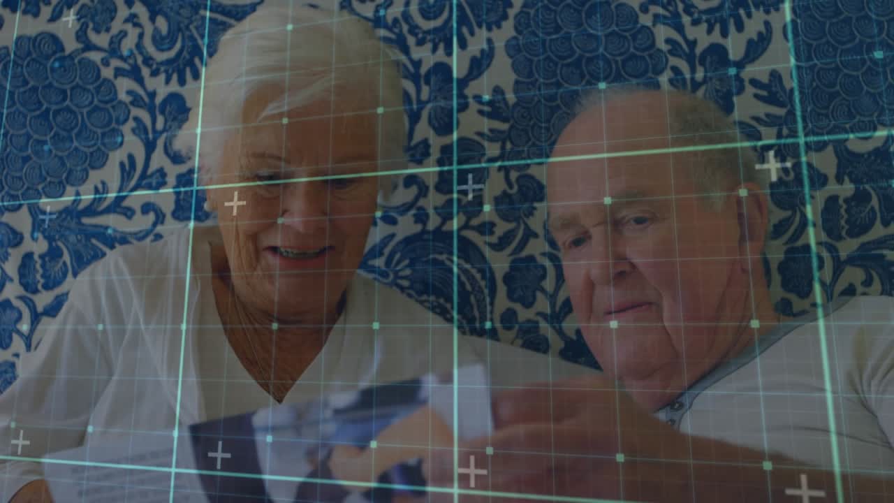 Animation of data processing over caucasian senior couple talking in hospital bed