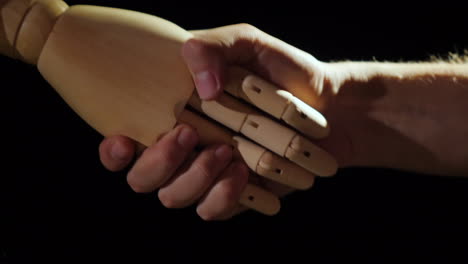 wooden hand handshake