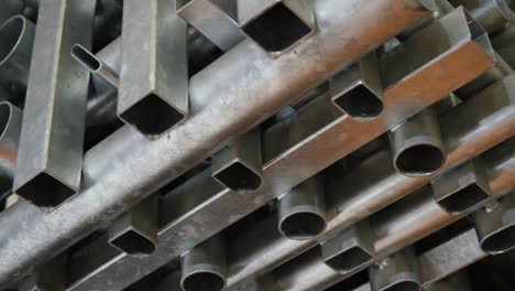 metal pipes used in the industry of various sizes and thicknesses are rotated and displayed.