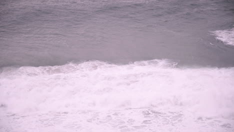 big waves break with an offshore wind