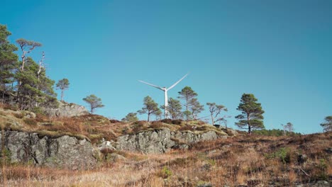 rotating wind turbine of windmill park nature reserve near hildremsvatnet, norway