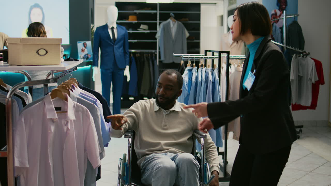 Man in Wheelchair Shopping for Clothes in a Store