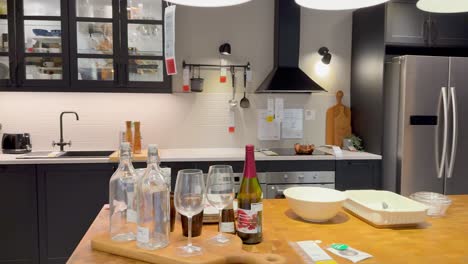 a kitchen setup with wine and tableware