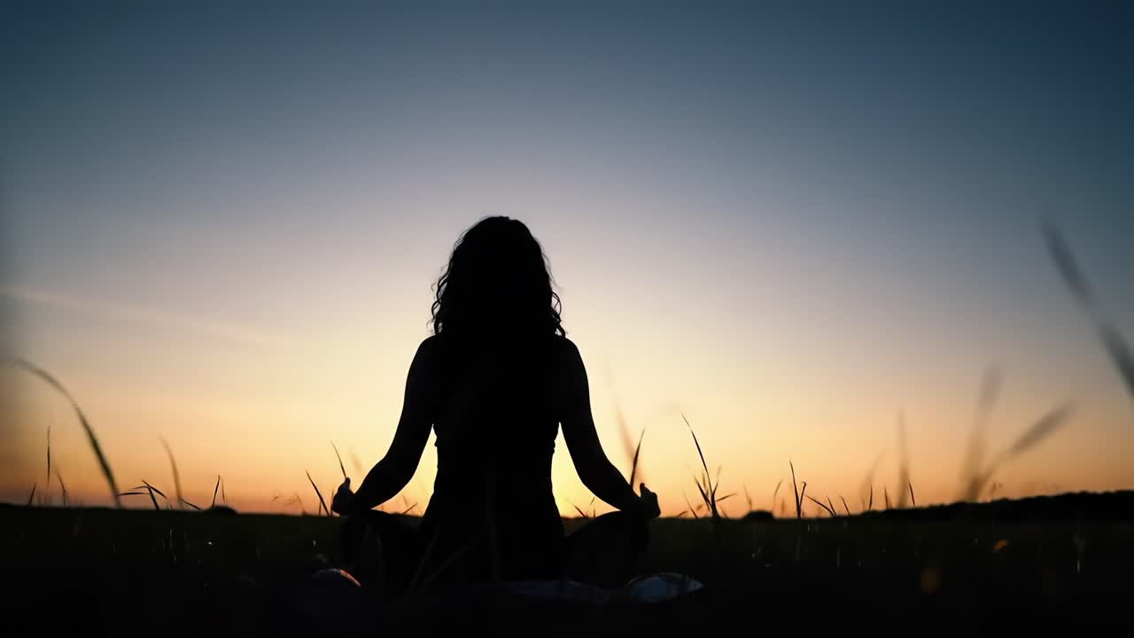 Peaceful Meditation at Sunset: Embracing Serenity and Mindfulness in a Beautiful Natural Landscape with Silhouette Against a Colorful Sky