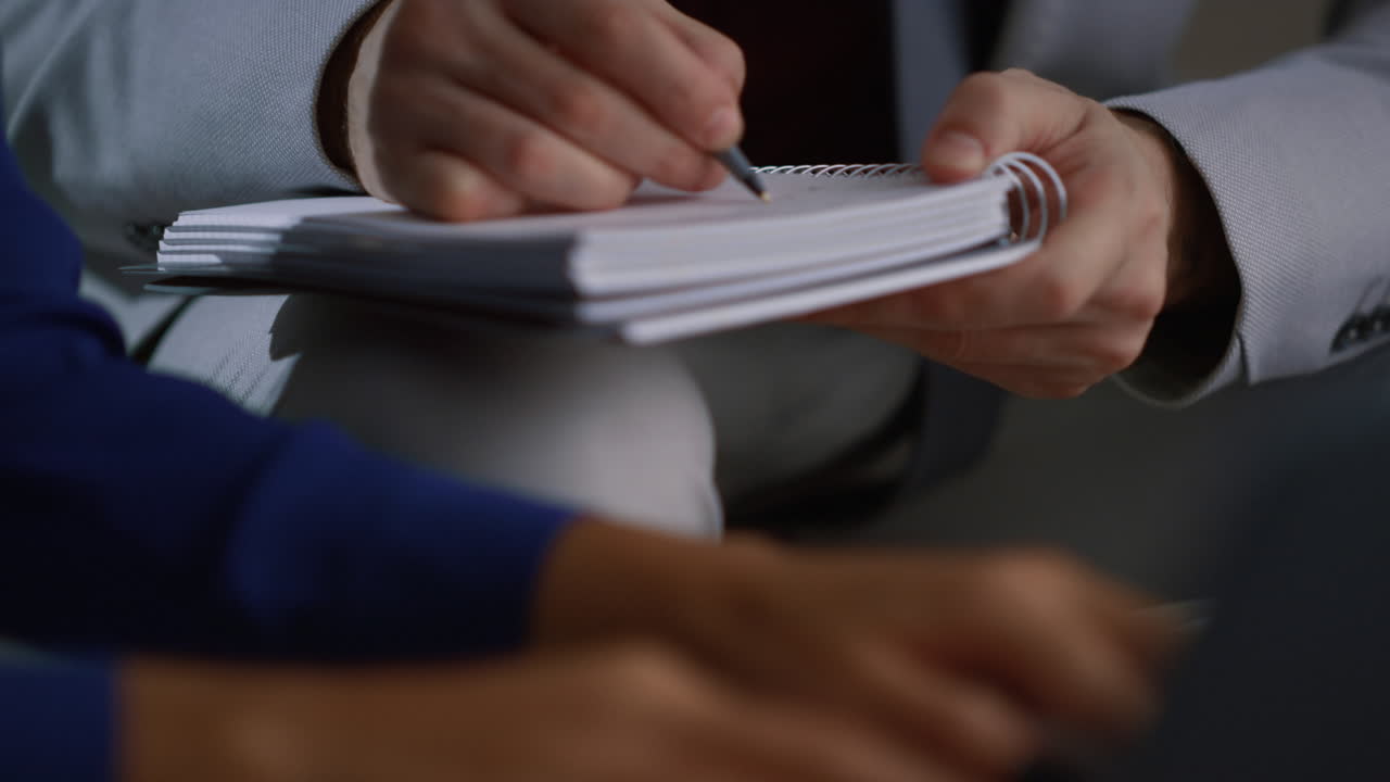 Multiethnic business people writing and typing