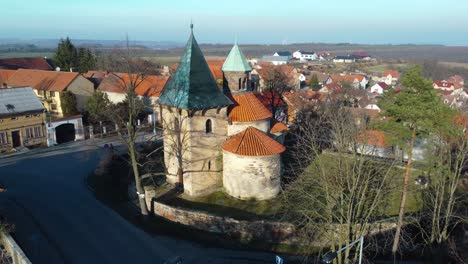 Flying-towards-the-rotunda-of-the-Nativity-of-the-Virgin-Mary-in-a-czech-village-Holubice