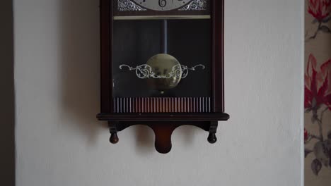 pendulum swinging on an old pendulum clock