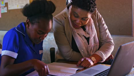 teacher helping schoolchildren in a lesson at a township school 4k