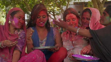 multi ethnic people celebrating the festival of colors holi in india