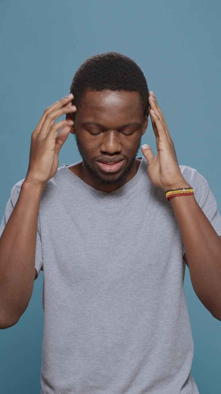 Man expressing emotions on a blue background