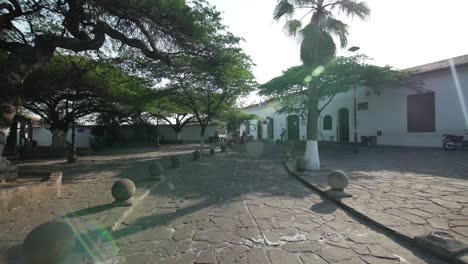 Push-in-shot-lens-flaring-of-colonial-park-in-giron-santander