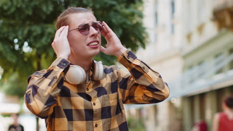 exhausted man male rubbing temples to cure headache problem suffering from tension migraine stress