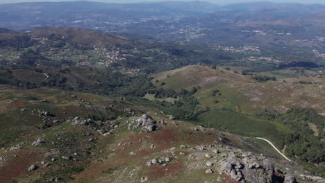 Establishing-shot-reveal-of-mountains-and-farms