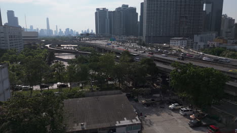 busy roads of si rat expressway at sunset in bangkok, thailand. aerial drone shot