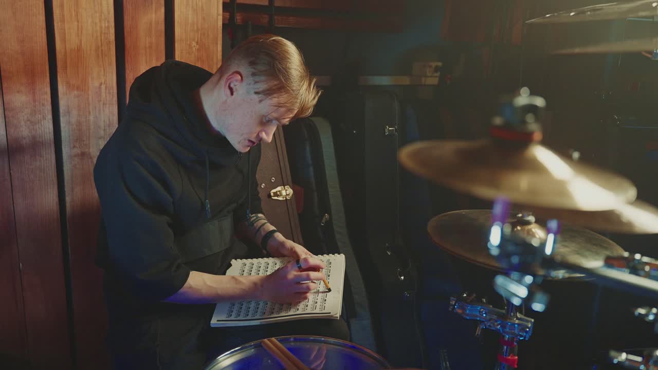 Drummer practicing in a music studio