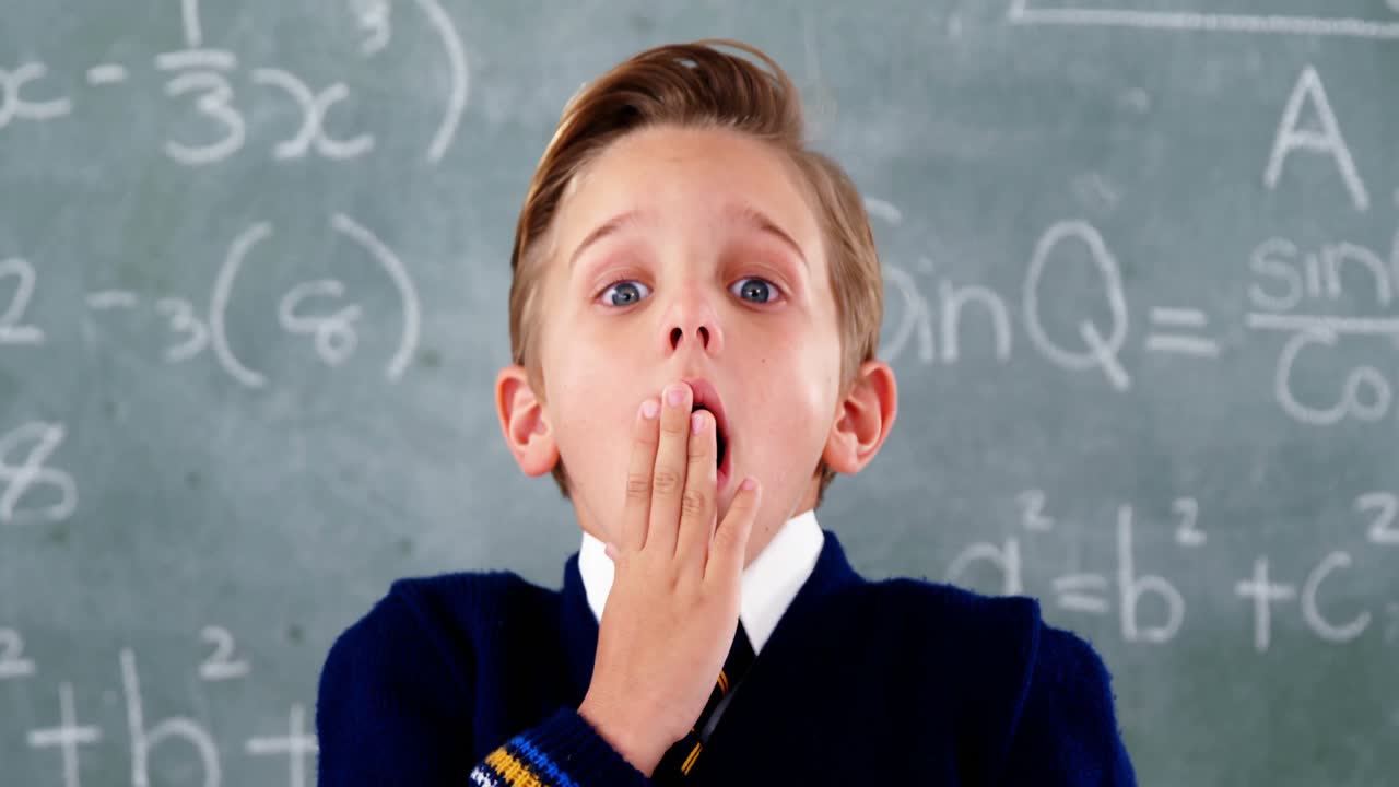 Schoolboy getting surprised in the classroom