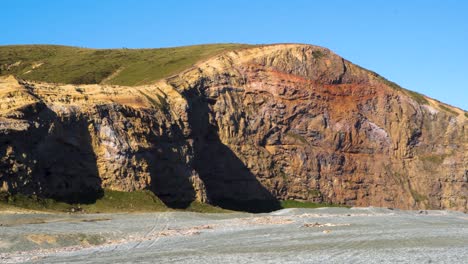 sunset on seaside cliffs and sea waves