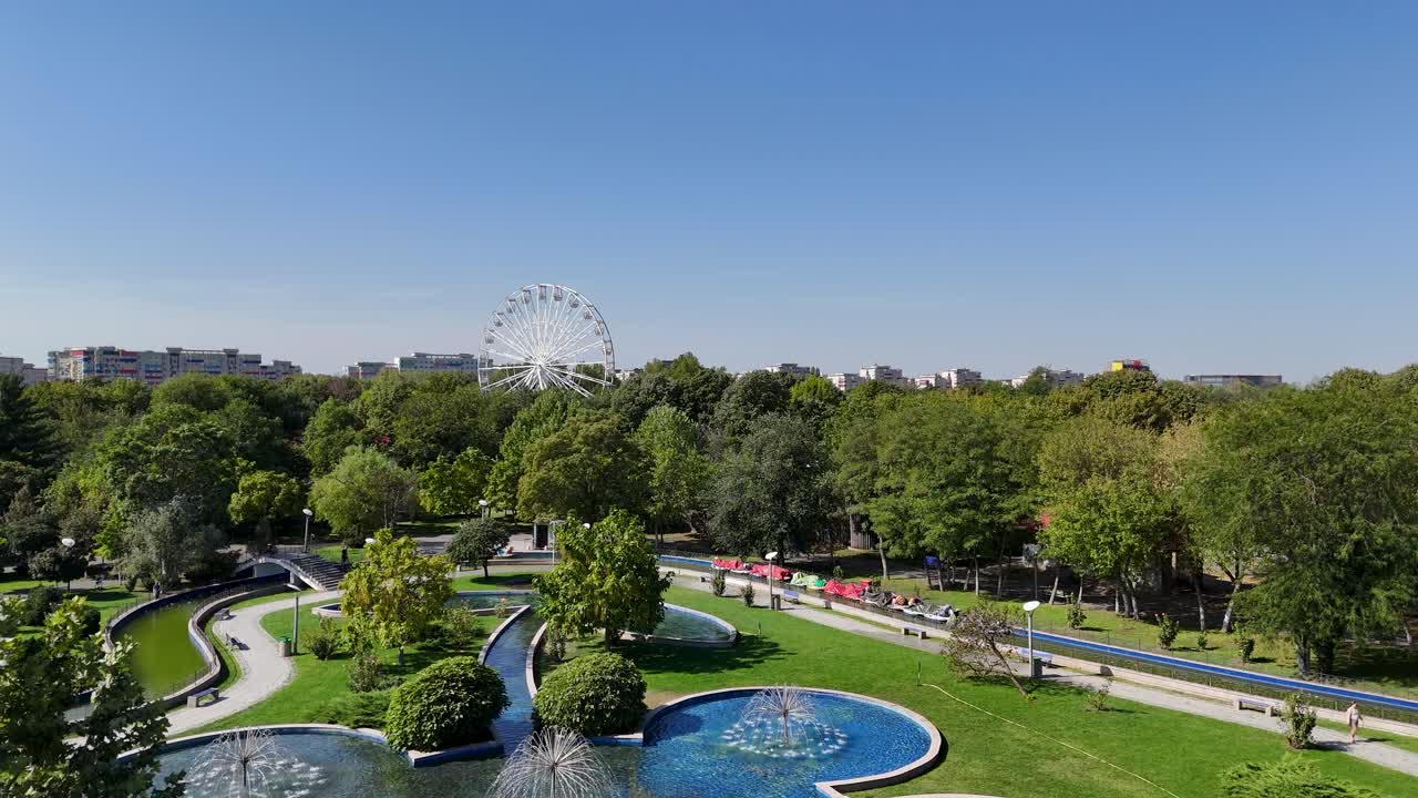 Beautiful City Park with Ferris Wheel and Fountains