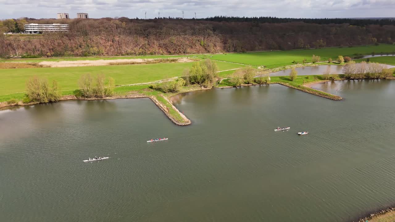 Aerial View of River with Rowing Boats and Cargo Ship