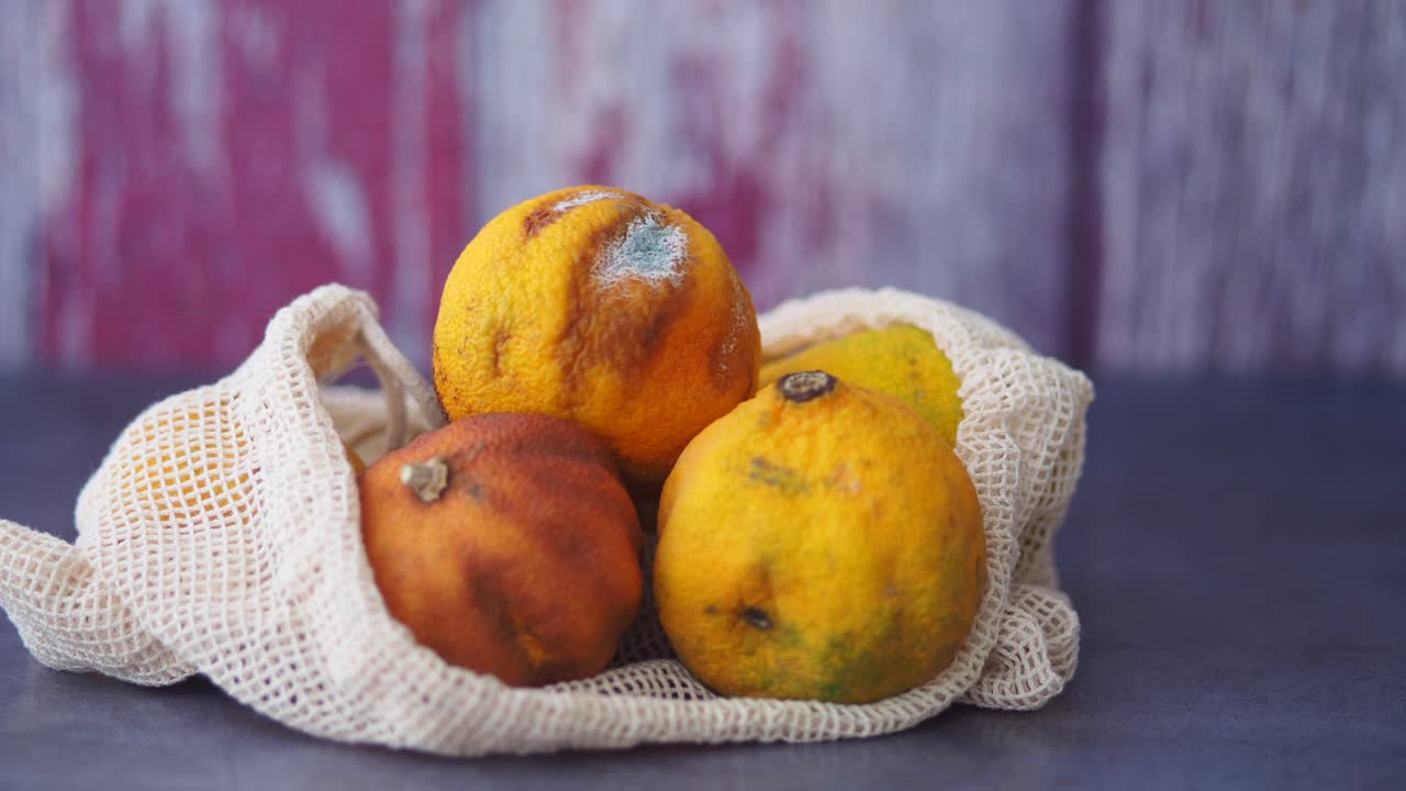 Rotten Oranges in Mesh Bag