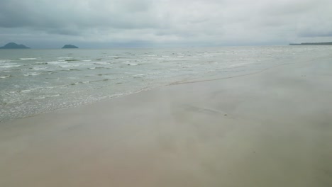 drone views of sempadi beach during monsoon season raining day asian tropical,sarawak,borneo.