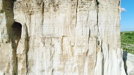 white rock cliff face with detail of strata