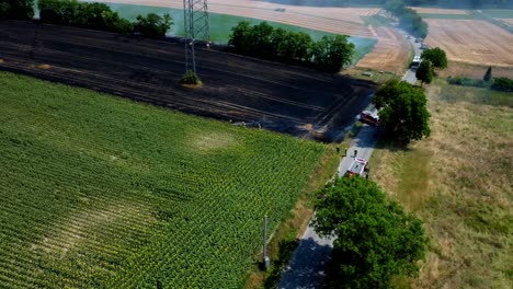 Firemen-Extinguish-A-Burning-Wheat-Field---aerial-shot