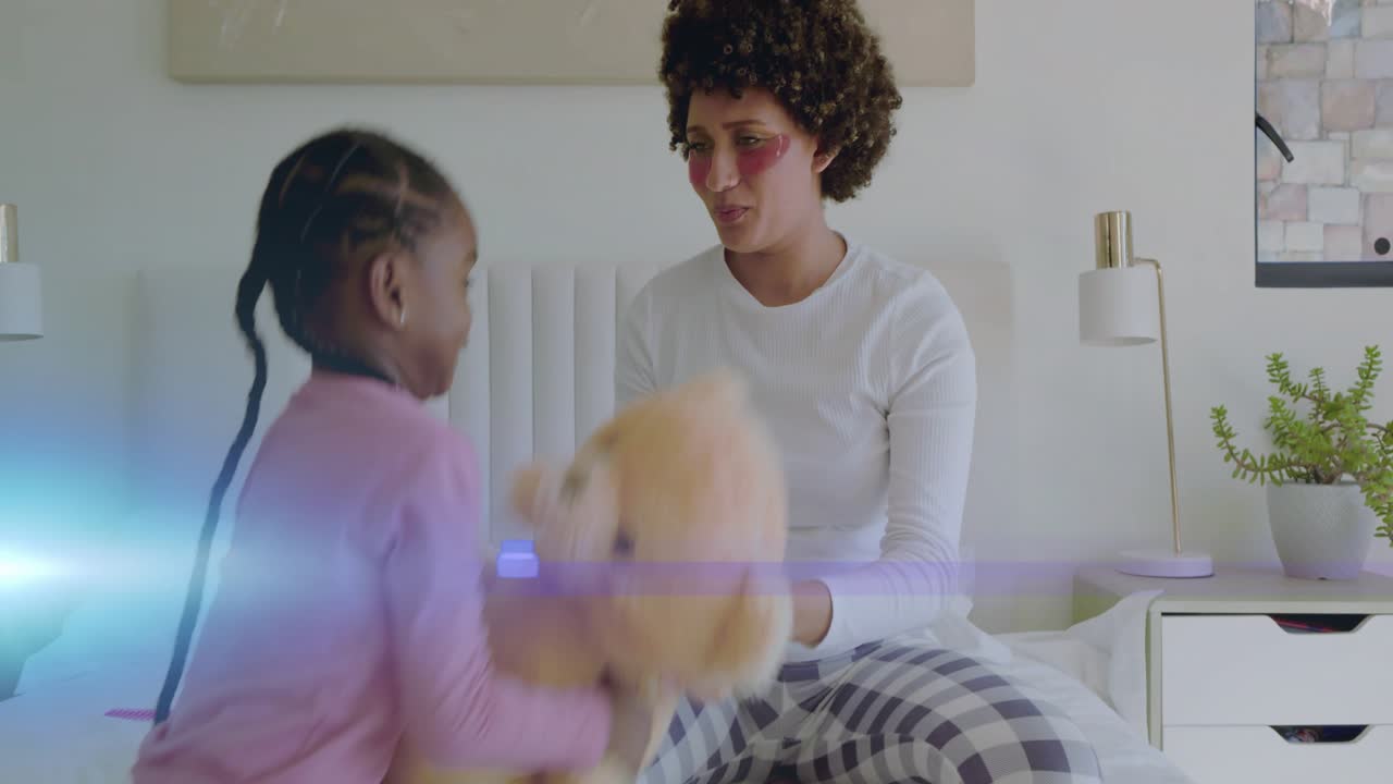 Parenting clip showing adult woman clapping and tickling child, causing teddy passing for bonding