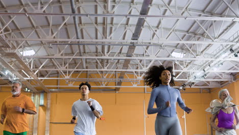 people running in an indoors track