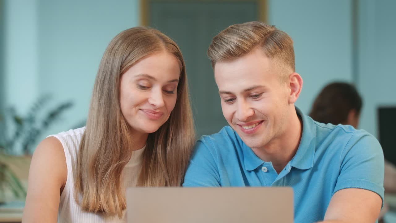 Handsome man discussing working questions. Smiling guy touching woman hair.