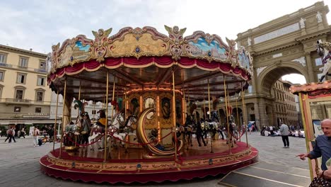 colorful carousel spinning in florence's historic square