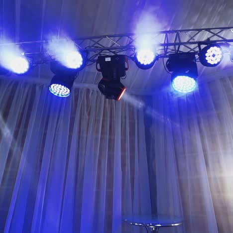 dynamic stage lighting setup with blue and white hues