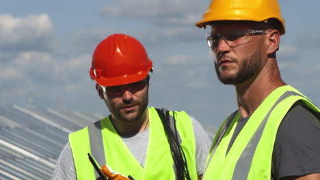 construction workers discussing on rooftop