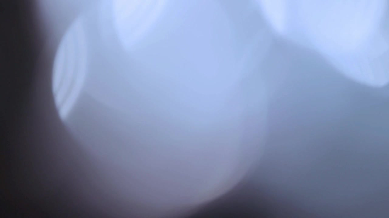 Abstract Light Bokeh Background with Soft Blue Glow