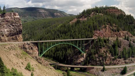 aerial footage of the green red cliff bridge, in red cliff colorado