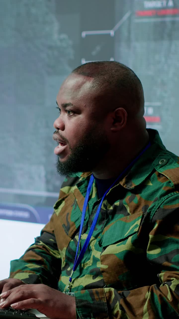 Vertical Video Government intelligence officer in operation room managing surveillance activity