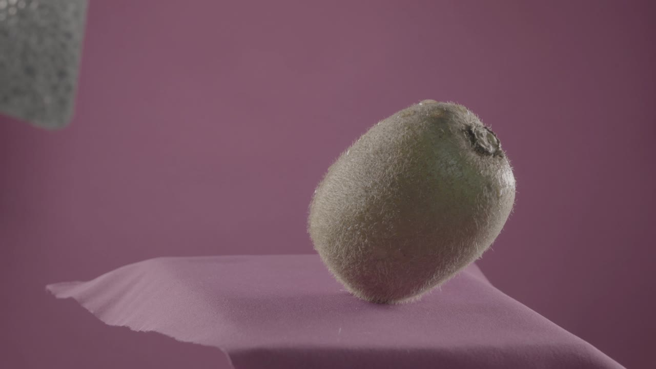 Kiwi rotating with loop on fuchsia screen for chroma key