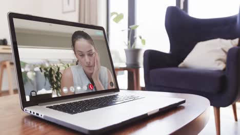 Caucasian-female-student-on-screen-of-laptop-online-learning